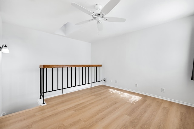 empty room with light hardwood / wood-style floors and ceiling fan