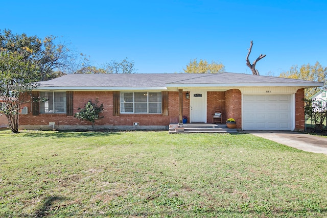 single story home featuring a front lawn and a garage