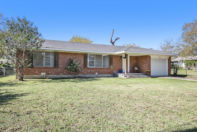 ranch-style house featuring a garage and a front yard