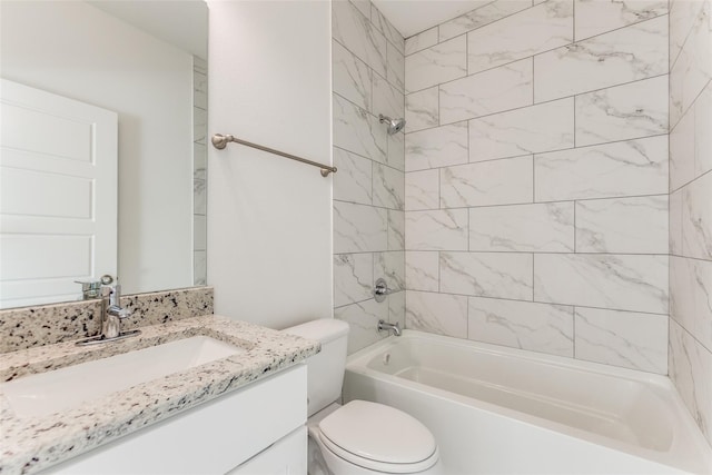 full bathroom featuring vanity, toilet, and tiled shower / bath combo