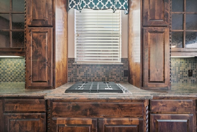 kitchen featuring tasteful backsplash, dark brown cabinets, and stainless steel gas cooktop