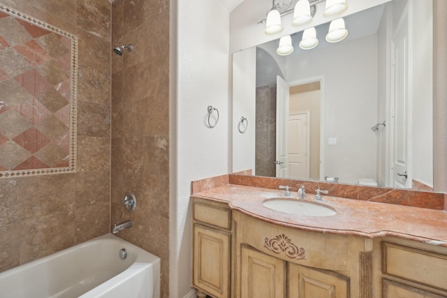 bathroom with vanity and tiled shower / bath