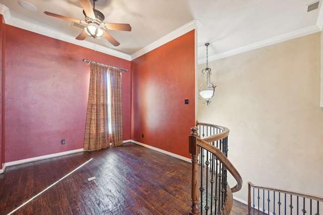 empty room featuring dark hardwood / wood-style floors, ceiling fan, and crown molding