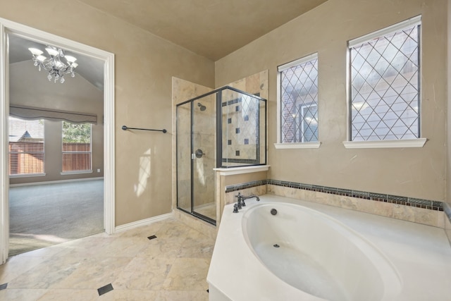 bathroom featuring plus walk in shower and a chandelier