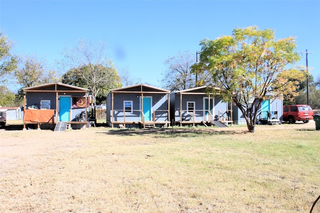 view of front of house featuring a shed