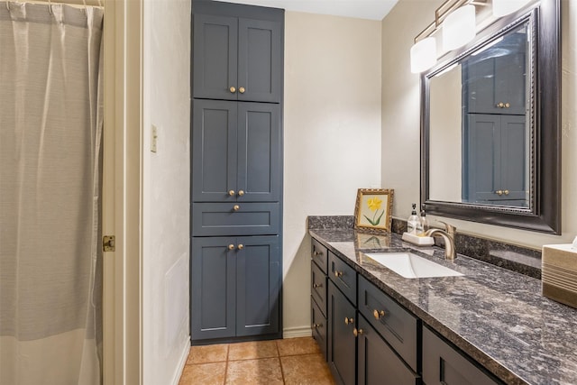 bathroom with tile patterned flooring and vanity