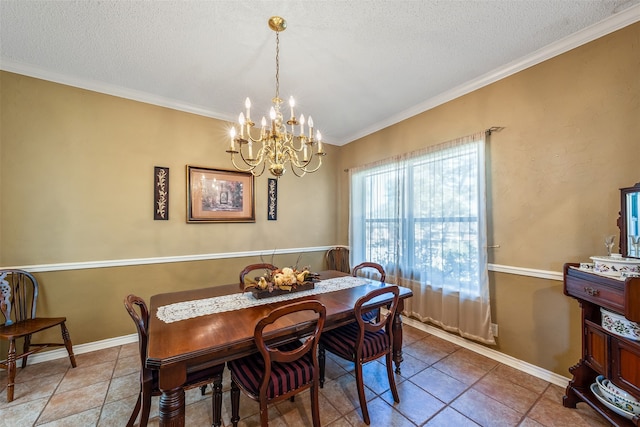 dining room with tile patterned flooring, ornamental molding, a chandelier, and a textured ceiling