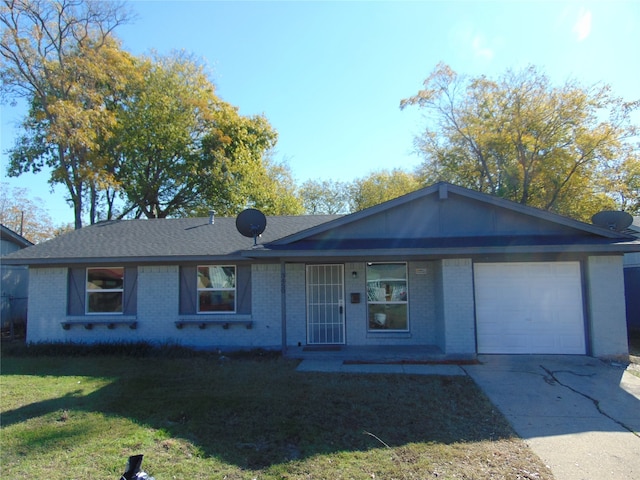 single story home featuring a garage and a front lawn