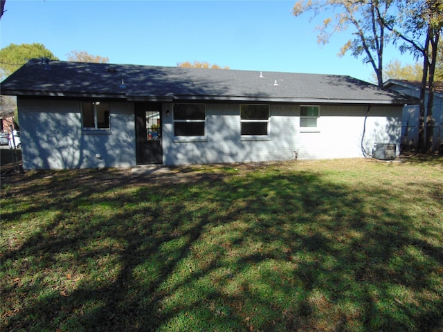 back of house with a yard