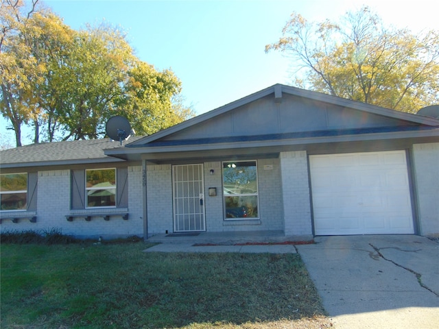 single story home featuring a garage and a front lawn