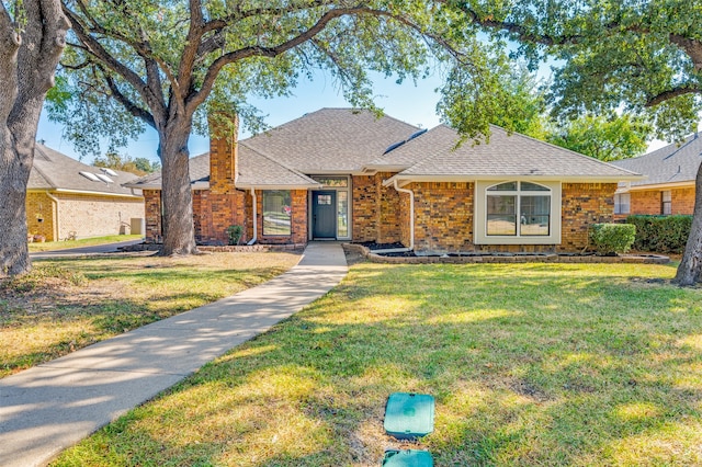 single story home featuring a front yard