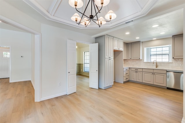 kitchen featuring stainless steel dishwasher, decorative light fixtures, a notable chandelier, and gray cabinetry