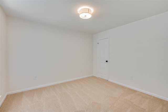 empty room featuring light colored carpet