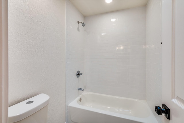 bathroom with toilet and shower / bathtub combination