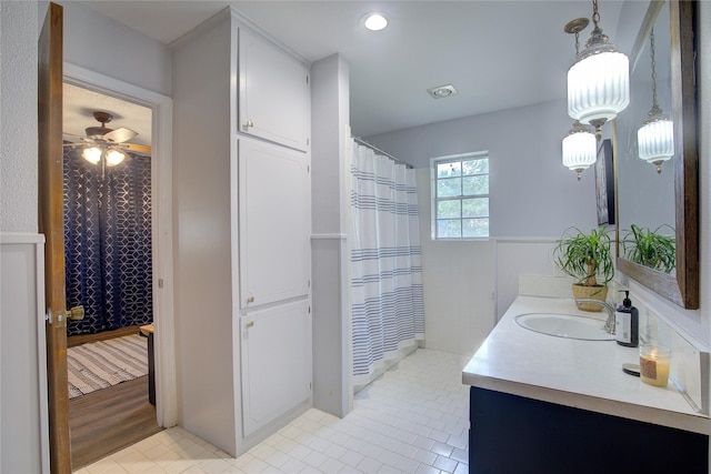 bathroom with ceiling fan, tile patterned floors, vanity, and a shower with shower curtain