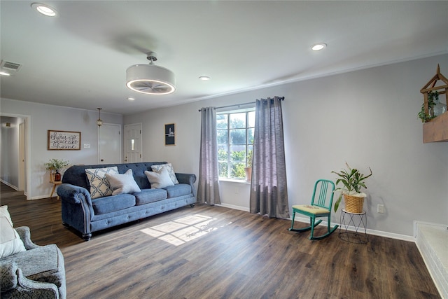 living room with dark hardwood / wood-style flooring