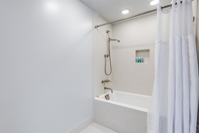 bathroom with tile patterned floors and shower / tub combo