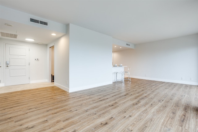 unfurnished living room featuring light hardwood / wood-style flooring