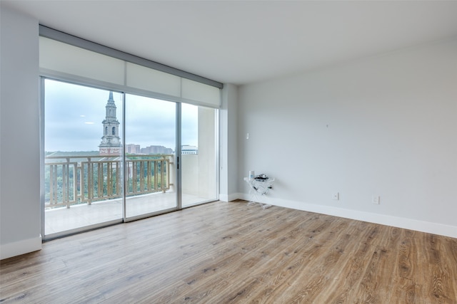 empty room with light hardwood / wood-style floors