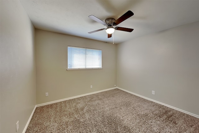 unfurnished room featuring ceiling fan and carpet floors