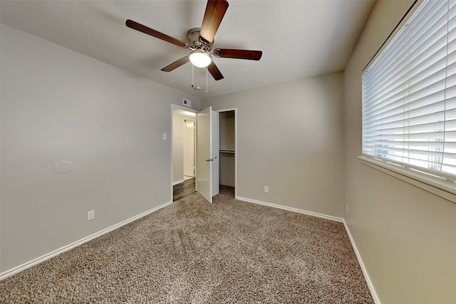 unfurnished bedroom featuring carpet and ceiling fan