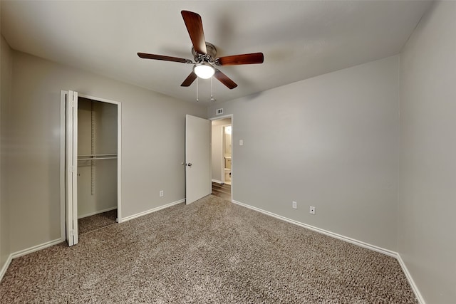 unfurnished bedroom with carpet, a closet, and ceiling fan