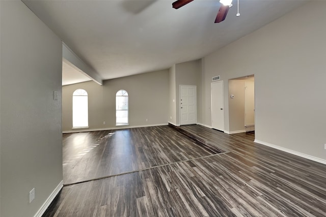 unfurnished living room with dark hardwood / wood-style floors, ceiling fan, and vaulted ceiling