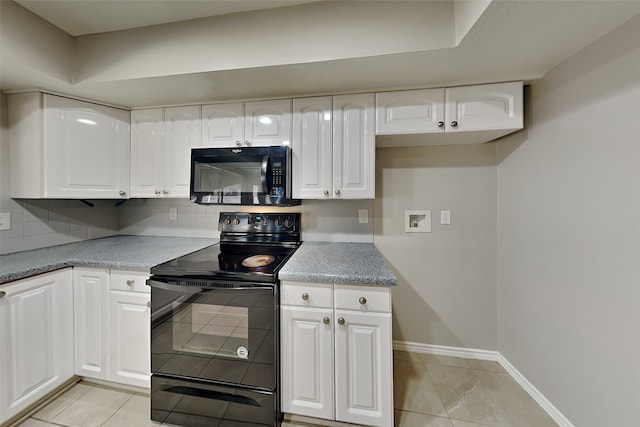 kitchen with decorative backsplash, light tile patterned floors, white cabinetry, and black appliances