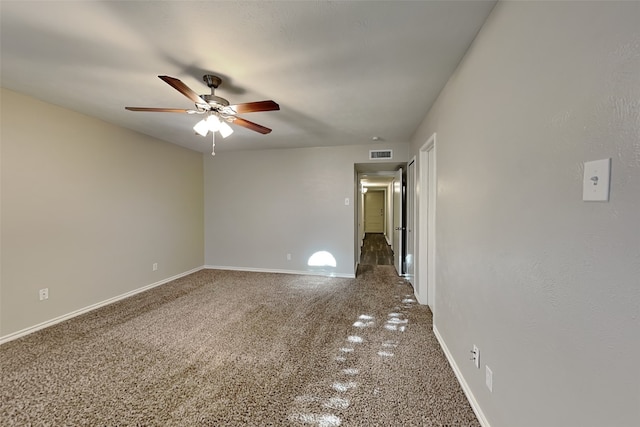 spare room featuring ceiling fan and carpet floors