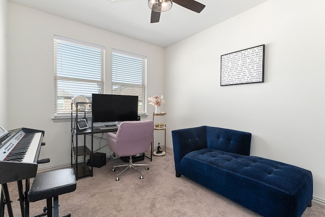 carpeted office space with ceiling fan