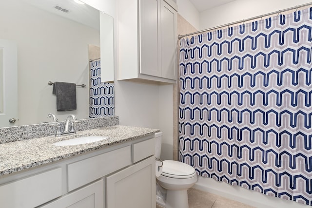 full bathroom featuring tile patterned floors, vanity, toilet, and shower / bathtub combination with curtain