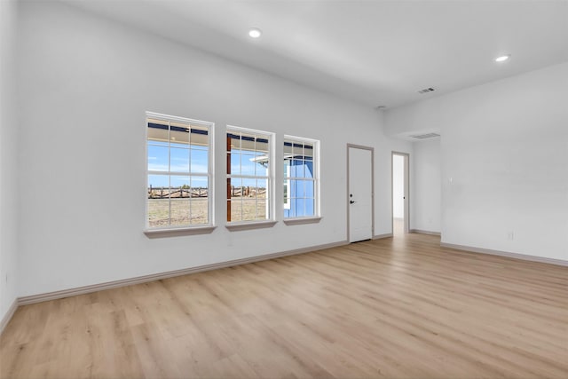 empty room with light hardwood / wood-style floors