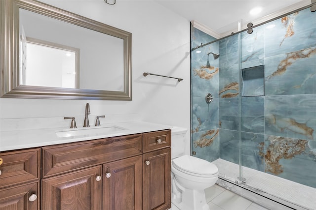 bathroom with vanity, toilet, and an enclosed shower