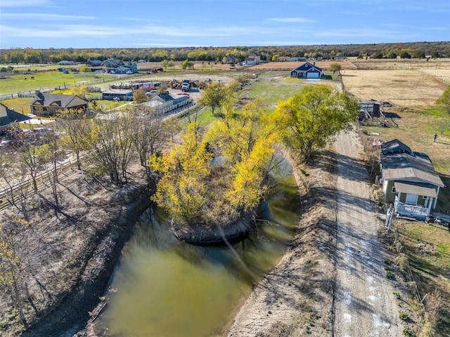 bird's eye view featuring a water view and a rural view