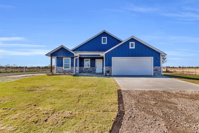 craftsman inspired home featuring a garage and a front yard