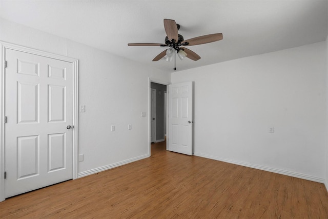 unfurnished bedroom featuring ceiling fan and light wood-type flooring