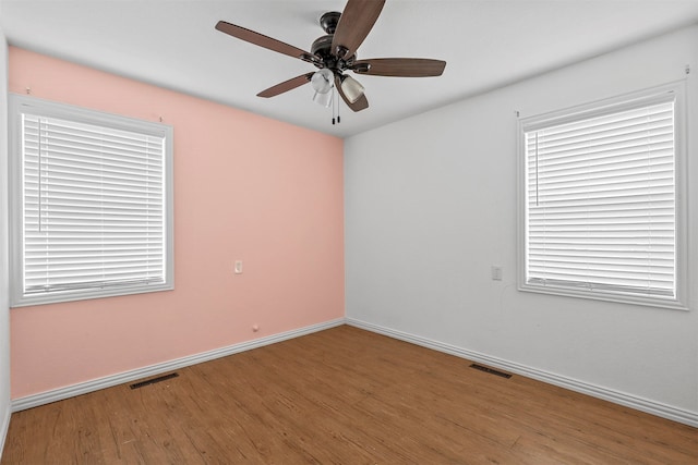 spare room featuring ceiling fan and wood-type flooring