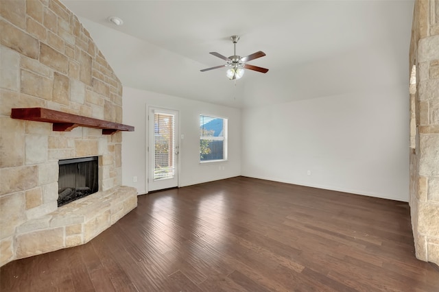 unfurnished living room featuring a fireplace, dark hardwood / wood-style flooring, ceiling fan, and lofted ceiling