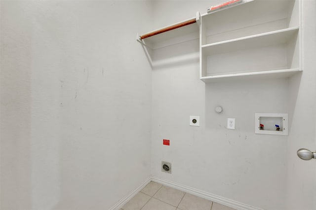 washroom featuring hookup for an electric dryer, hookup for a washing machine, hookup for a gas dryer, and light tile patterned floors