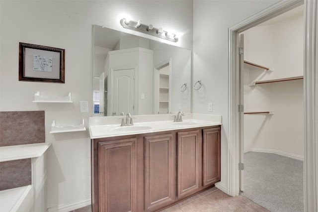 bathroom featuring tile patterned floors and vanity