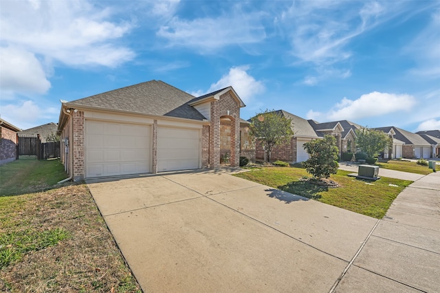 ranch-style house with a garage and a front yard