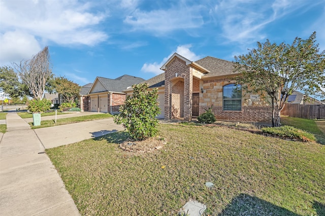 view of front facade featuring a front yard and a garage