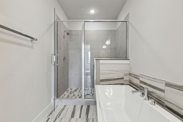 bathroom featuring plus walk in shower