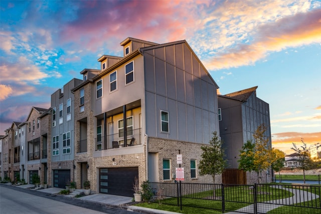 outdoor building at dusk featuring a garage