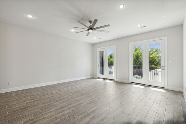 spare room featuring ceiling fan and wood-type flooring