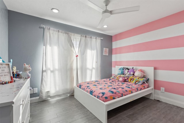 bedroom featuring wood-type flooring and ceiling fan