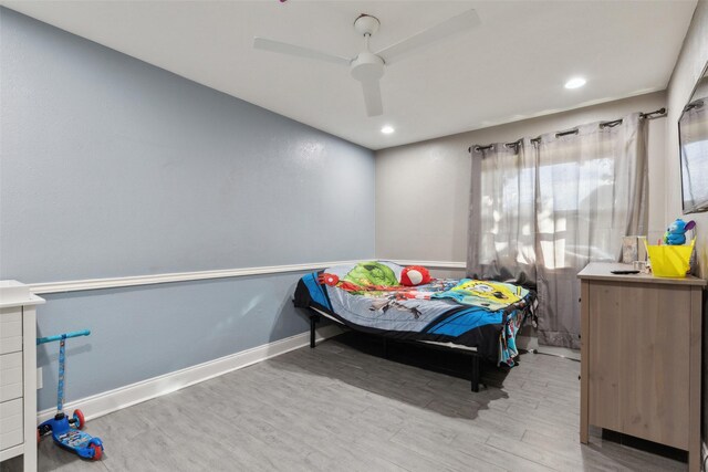 bedroom featuring hardwood / wood-style flooring and ceiling fan