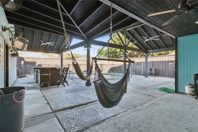 view of patio / terrace with ceiling fan and exterior bar