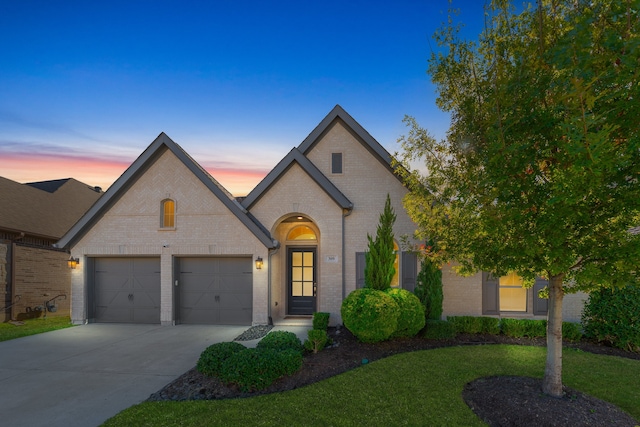 french country style house featuring a yard