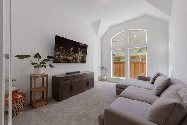 living room with light colored carpet and lofted ceiling